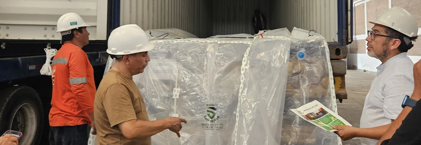 Exporters load green coffee into an Ecotact container liner.